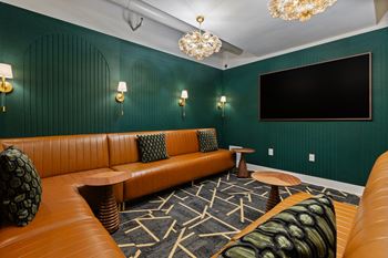 Theater room with leather seating and large screen